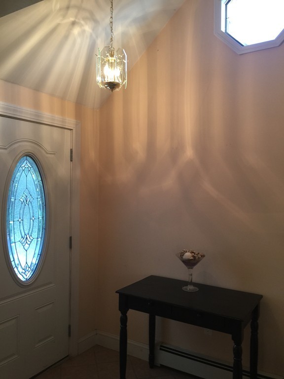 30 Tinson Road Quincy, MA 02169 - Photo 2 of 10 a room with a table and a window