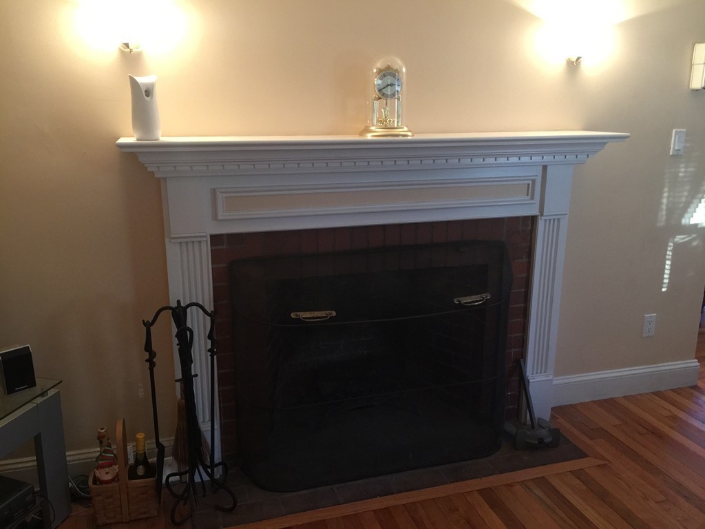 30 Tinson Road Quincy, MA 02169 - Photo 3 of 10 a close view of a fireplace in the room