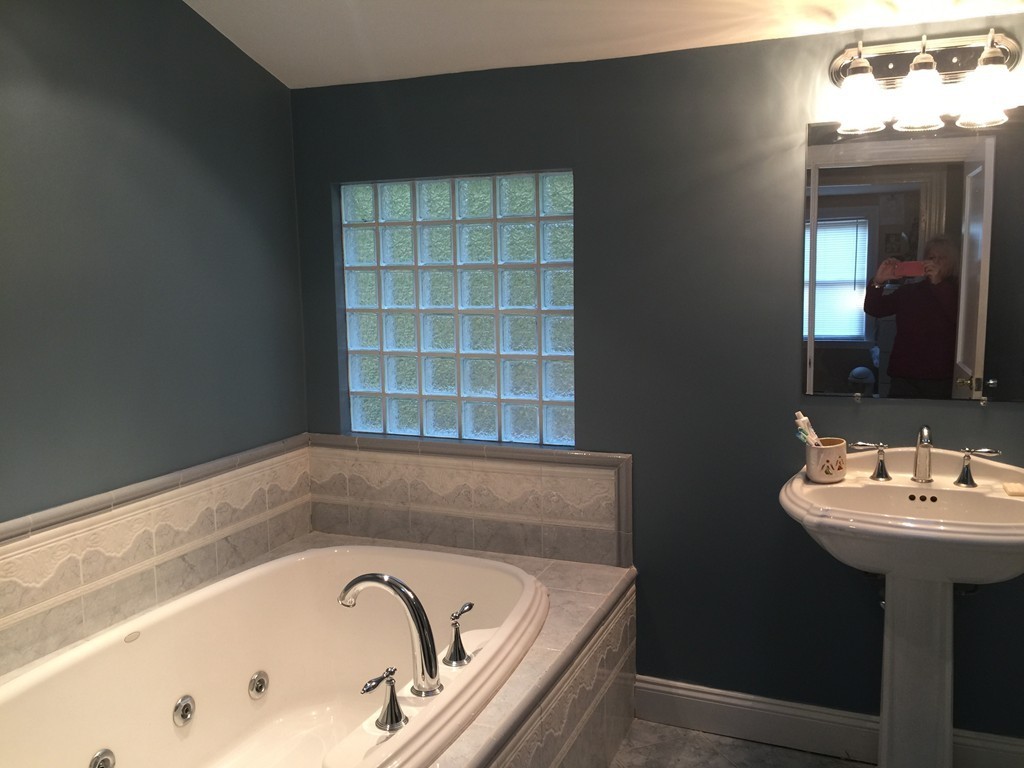 30 Tinson Road Quincy, MA 02169 - Photo 7 of 10 a bathroom with a bathtub and a sink