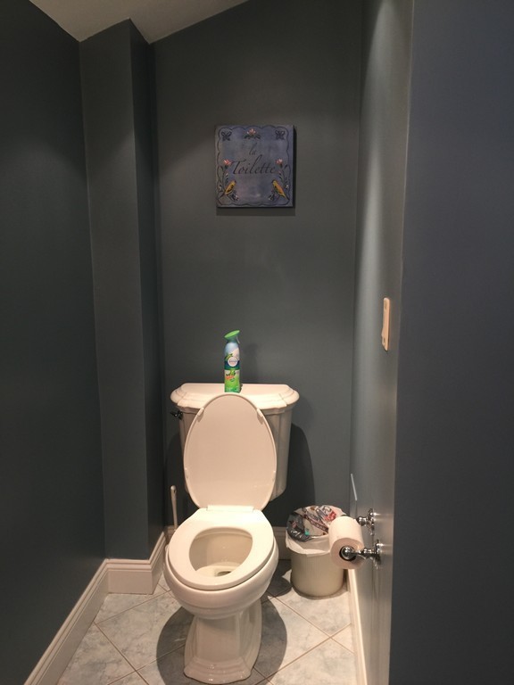 30 Tinson Road Quincy, MA 02169 - Photo 9 of 10 a white toilet sitting next to a bathroom sink