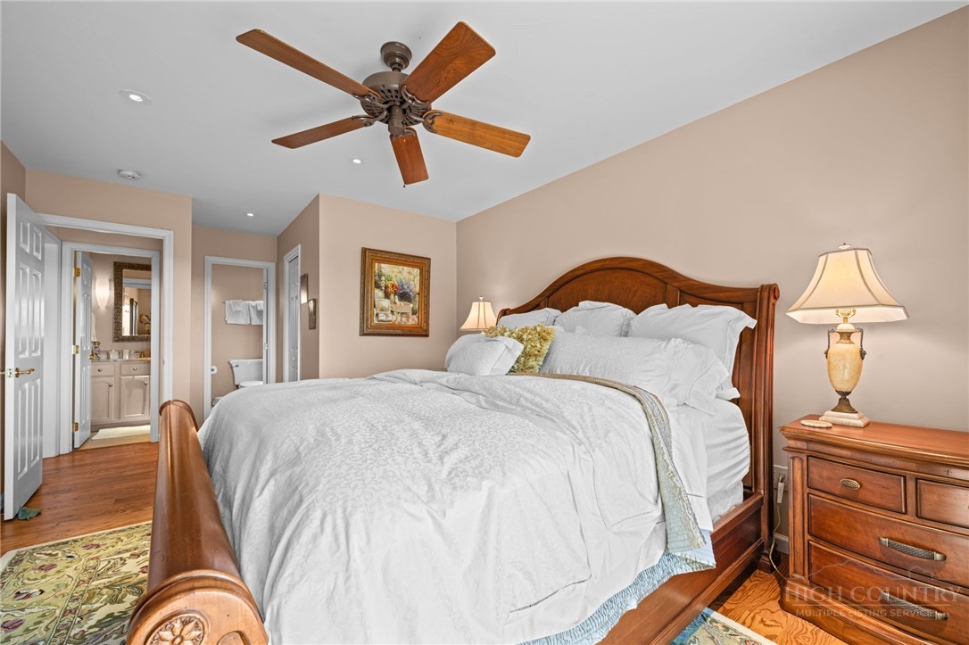 331 Alpine Road Blowing Rock, NC 28605 - Photo 31 of 50 a bedroom with a bed and wooden floor