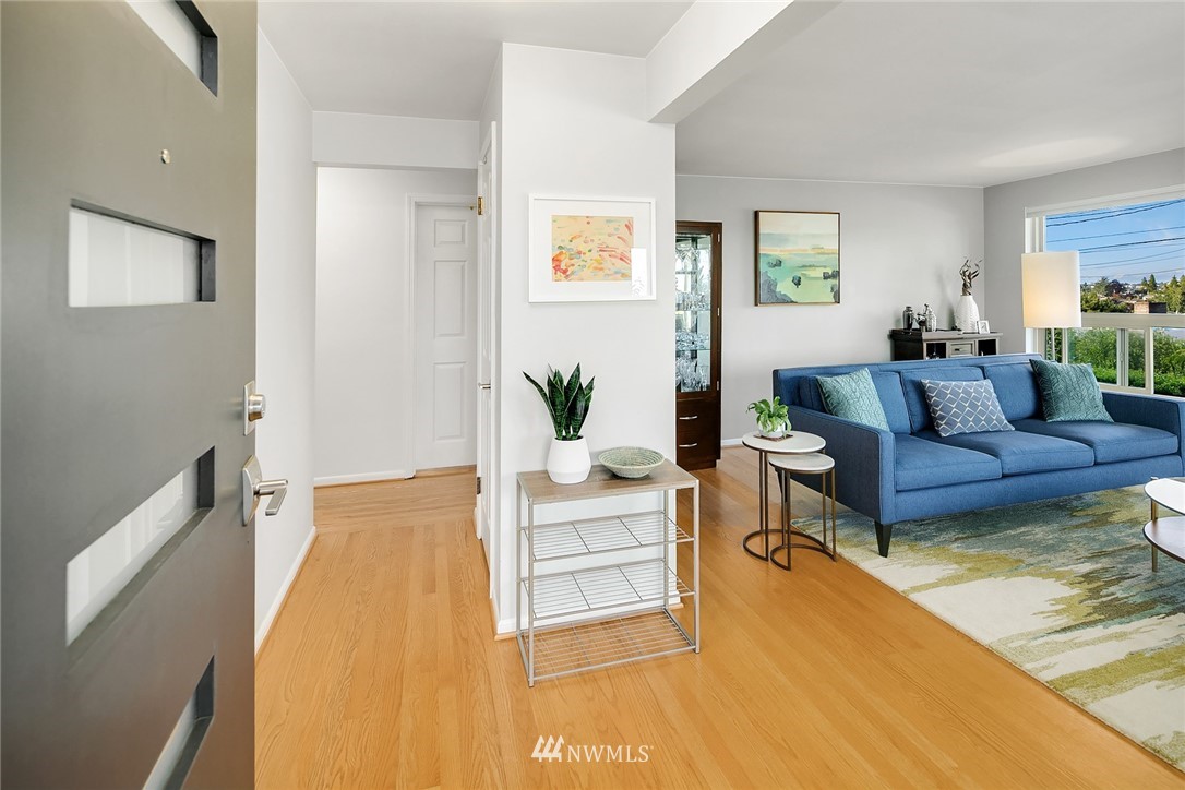 3704 West Dravus Street Seattle, WA 98199 - Photo 2 of 35 a living room with furniture and a table