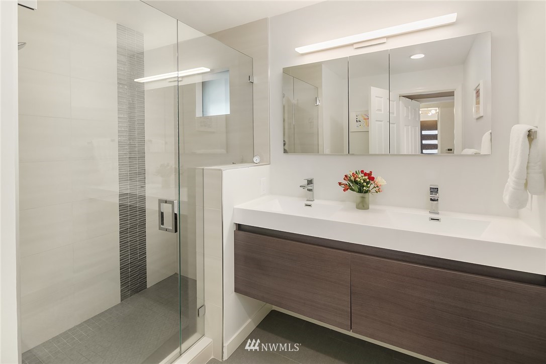 3704 West Dravus Street Seattle, WA 98199 - Photo 18 of 35 a bathroom with a sink and a mirror
