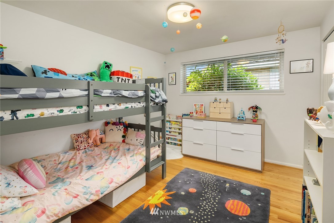 3704 West Dravus Street Seattle, WA 98199 - Photo 19 of 35 a bedroom with a bed and a window