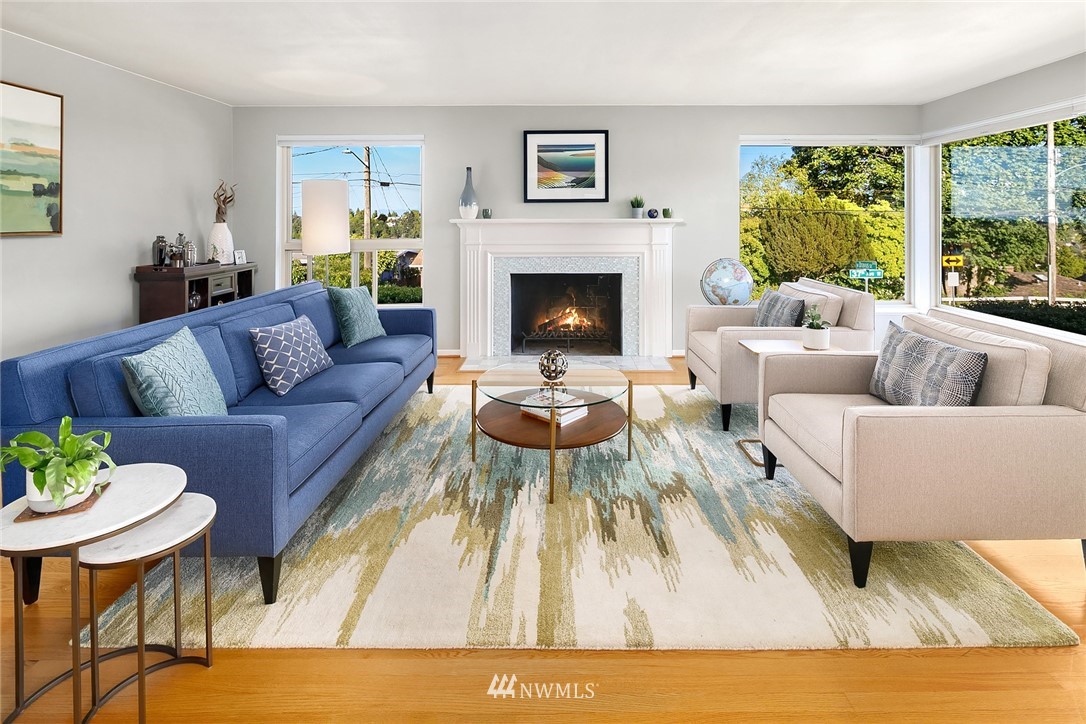 3704 West Dravus Street Seattle, WA 98199 - Photo 3 of 35 a living room with furniture and a fireplace