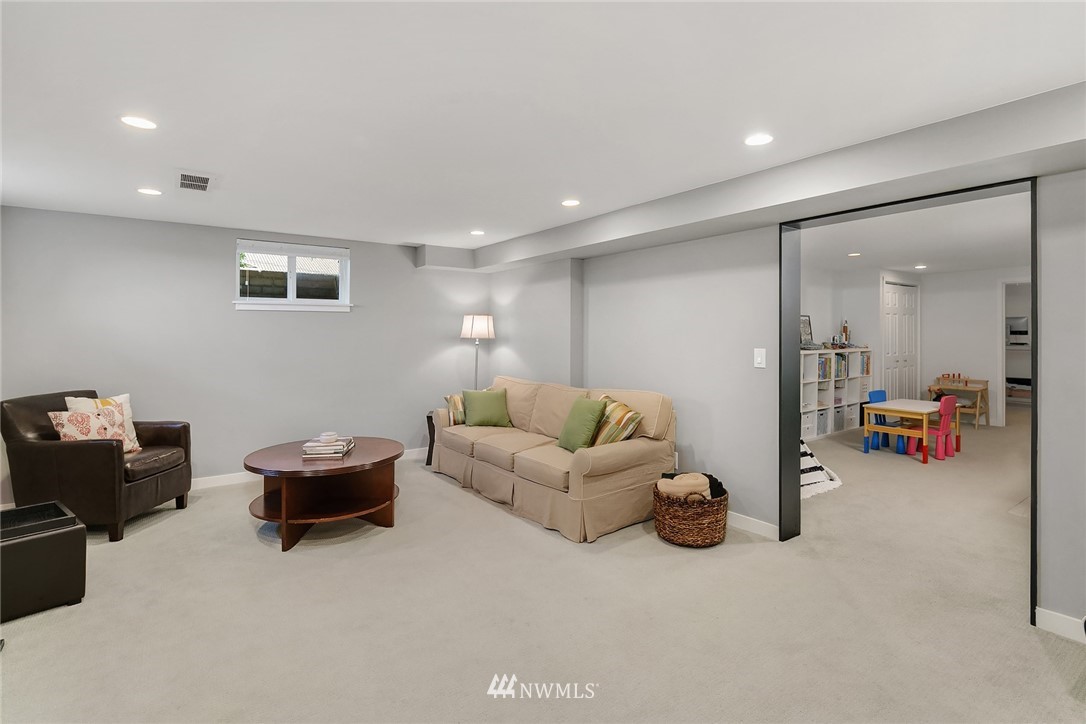 3704 West Dravus Street Seattle, WA 98199 - Photo 24 of 35 a living room with furniture and a gym