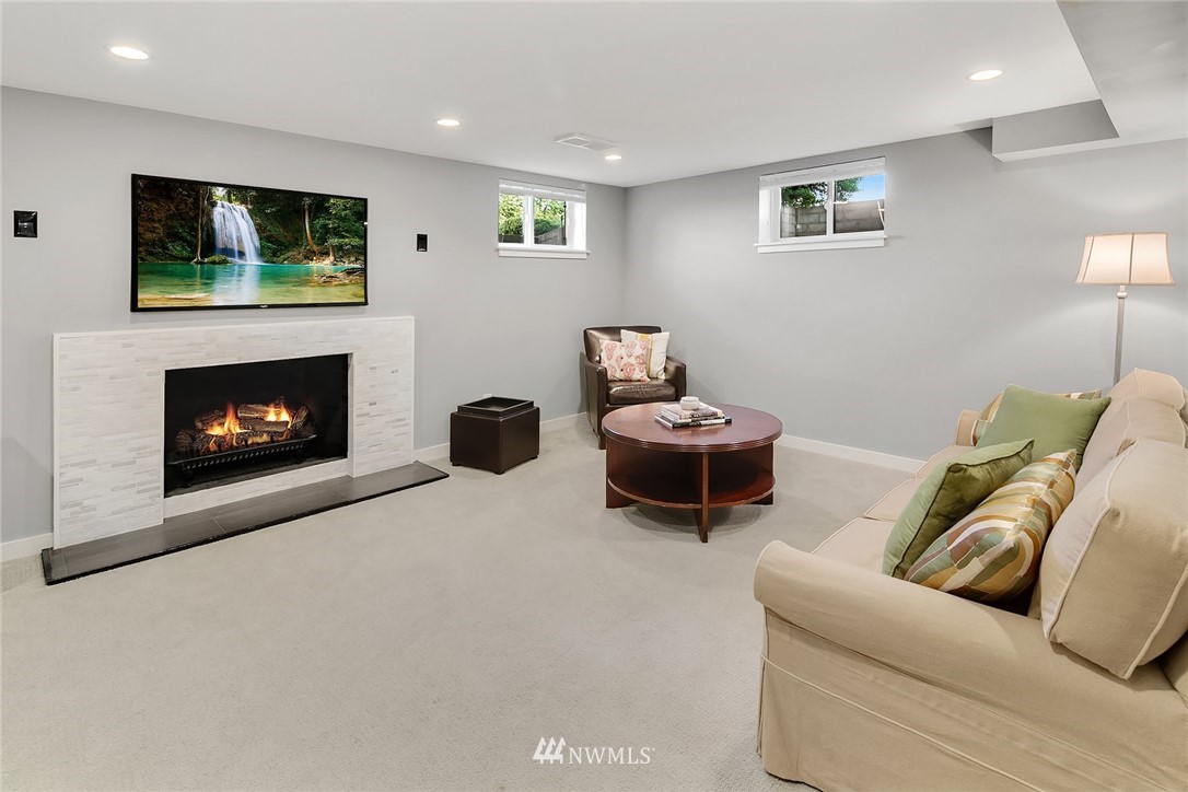 3704 West Dravus Street Seattle, WA 98199 - Photo 26 of 35 a living room with furniture and a fireplace