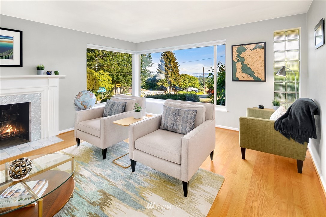 3704 West Dravus Street Seattle, WA 98199 - Photo 4 of 35 a living room with furniture and a fireplace