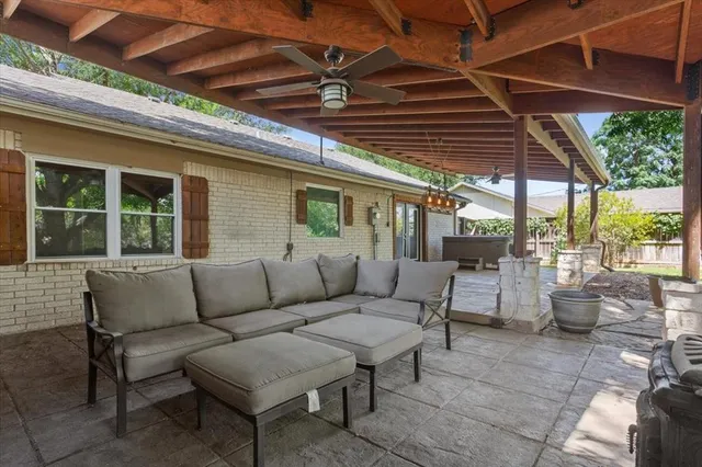 a outdoor living space with patio furniture and garden