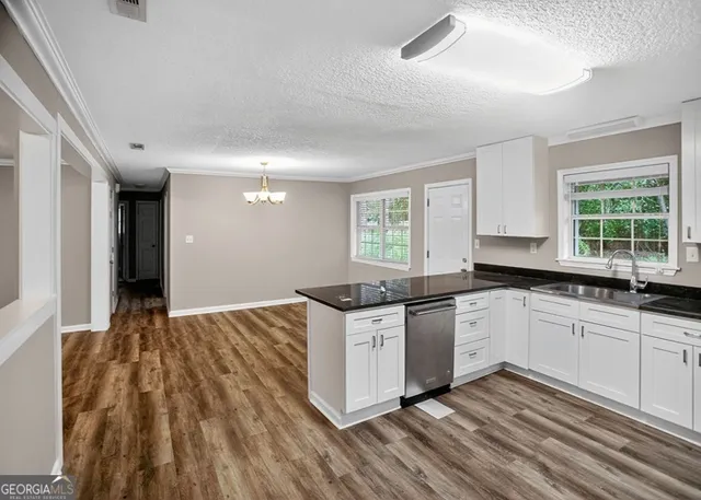 a bathroom with a granite countertop sink mirror and shower