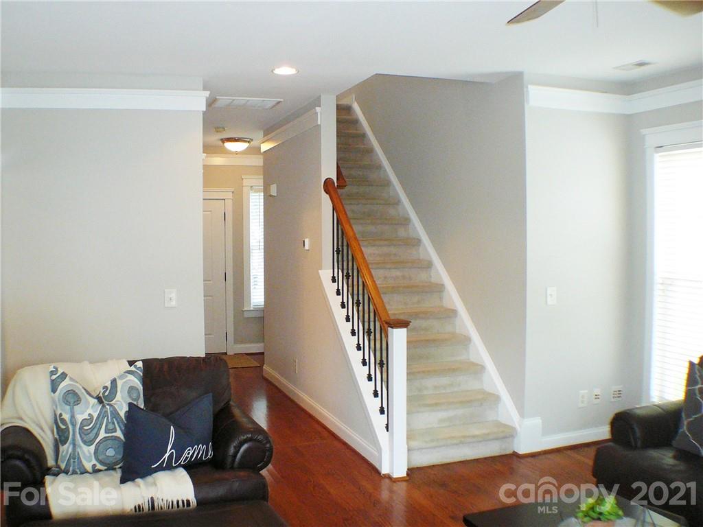 8111 Townley Road Huntersville, NC 28078 - Photo 11 of 27 a living room with furniture and stairs
