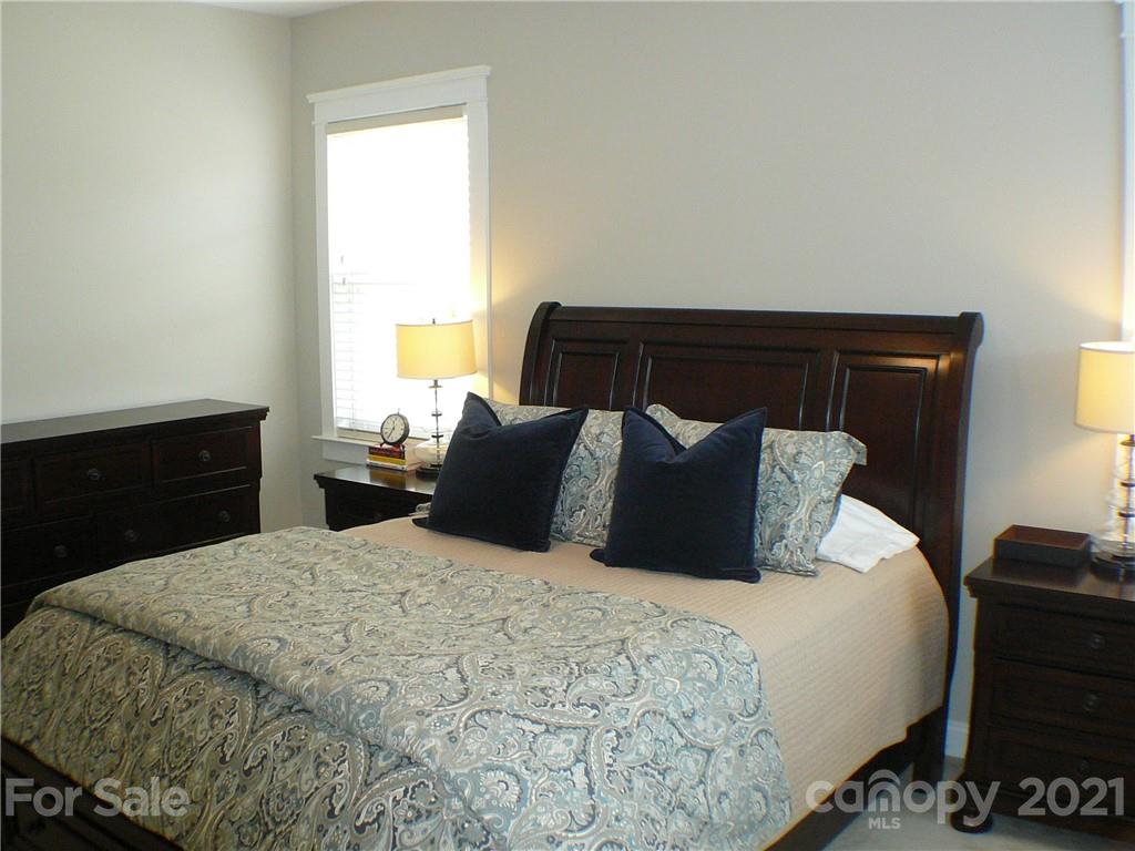 8111 Townley Road Huntersville, NC 28078 - Photo 14 of 27 a bedroom with a bed and a dressers