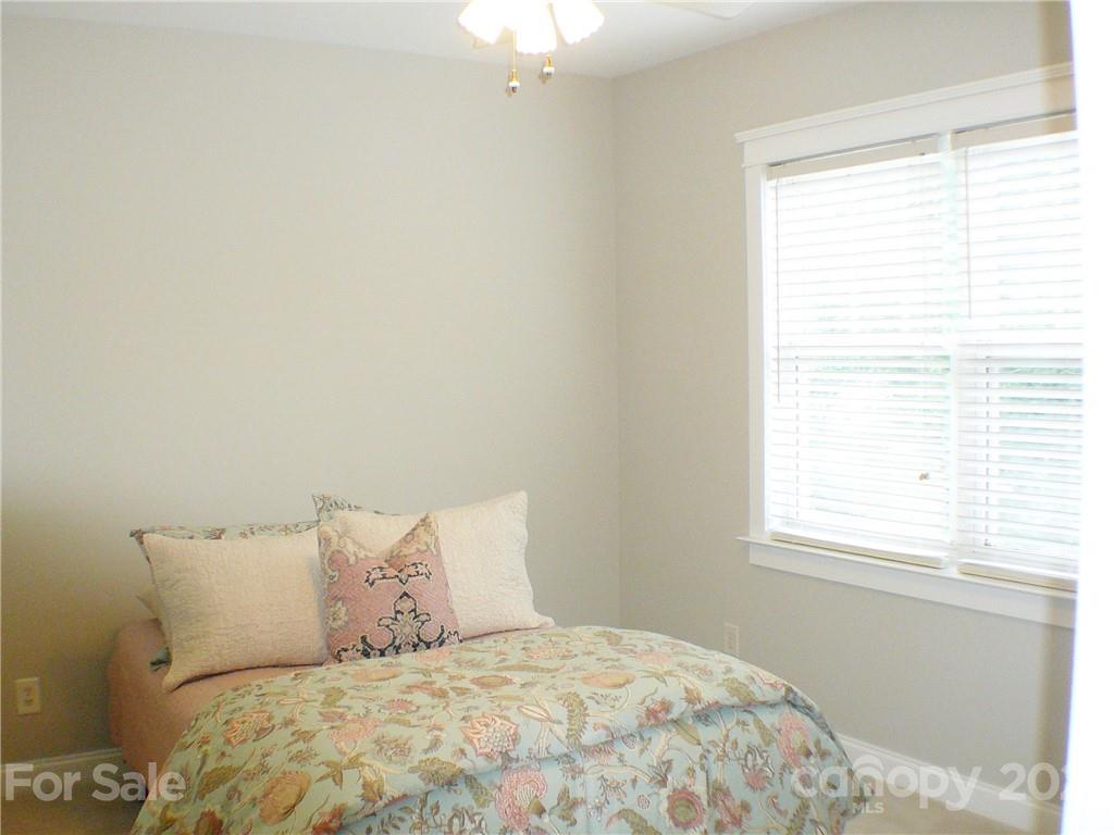 8111 Townley Road Huntersville, NC 28078 - Photo 16 of 27 a large bed sitting in a bedroom next to a window