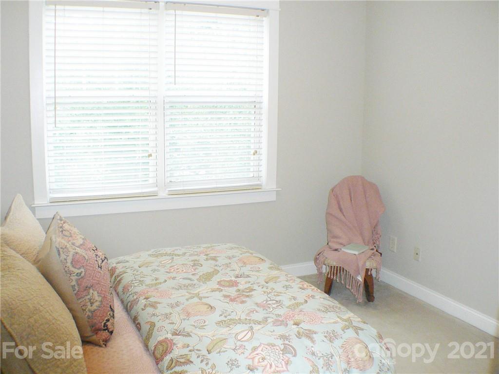 8111 Townley Road Huntersville, NC 28078 - Photo 17 of 27 a bedroom with a bed dresser and a window