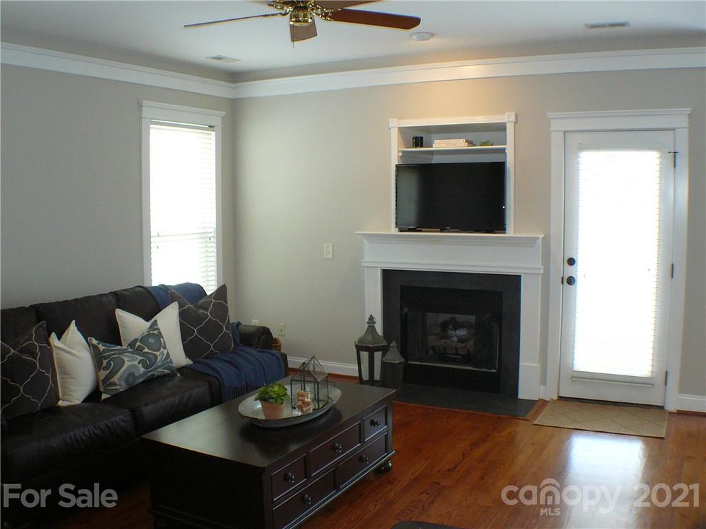 8111 Townley Road Huntersville, NC 28078 - Photo 3 of 27 a living room with furniture and a fireplace