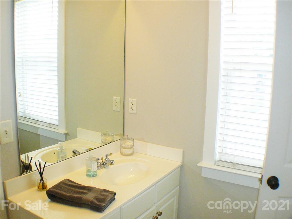 8111 Townley Road Huntersville, NC 28078 - Photo 21 of 27 a bathroom with a sink and a window