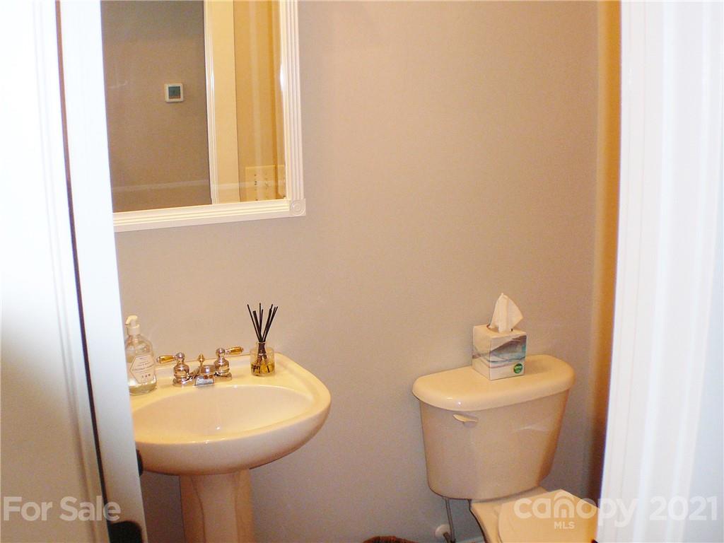 8111 Townley Road Huntersville, NC 28078 - Photo 22 of 27 a bathroom with a toilet sink and mirror