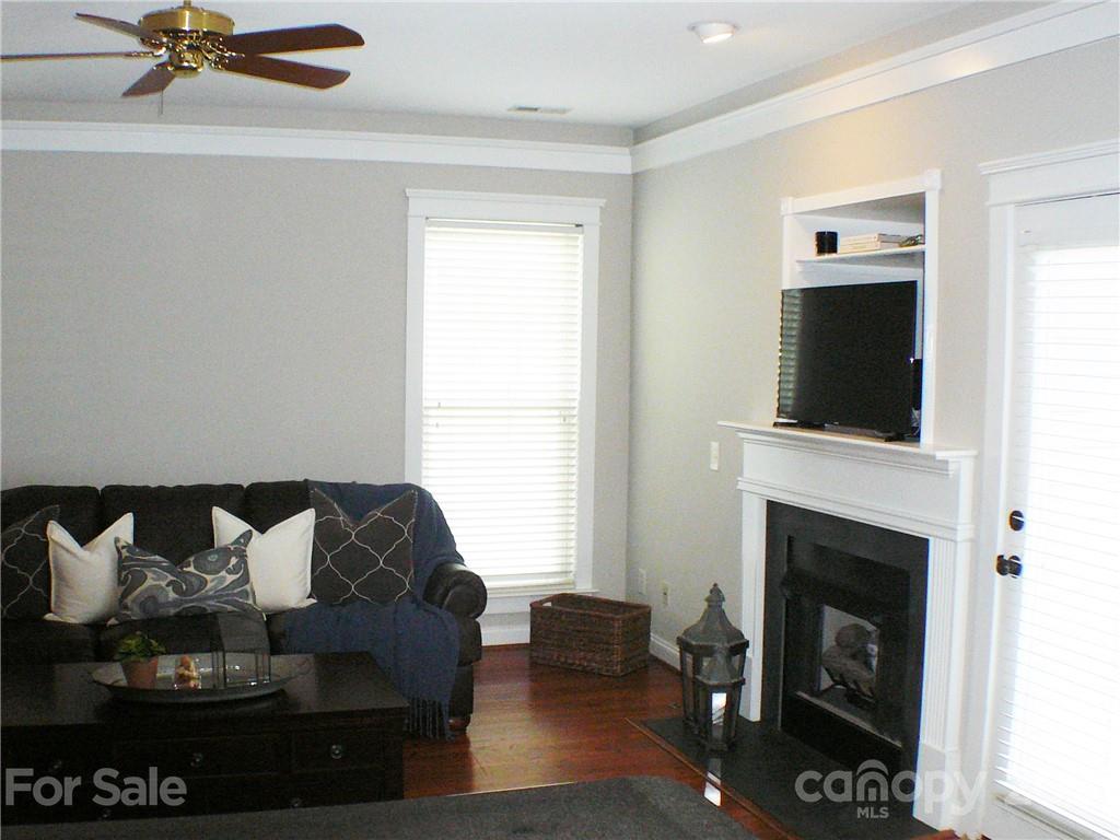 8111 Townley Road Huntersville, NC 28078 - Photo 4 of 27 a living room with furniture and a fireplace
