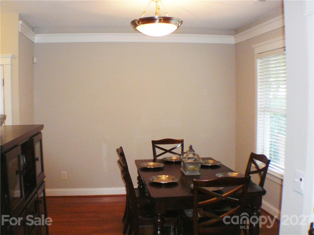 8111 Townley Road Huntersville, NC 28078 - Photo 6 of 27 a view of a dining room with furniture and wooden floor