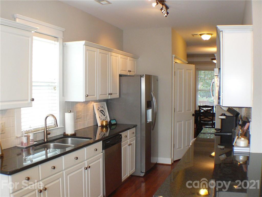 8111 Townley Road Huntersville, NC 28078 - Photo 7 of 27 a kitchen with stainless steel appliances granite countertop a refrigerator and a sink