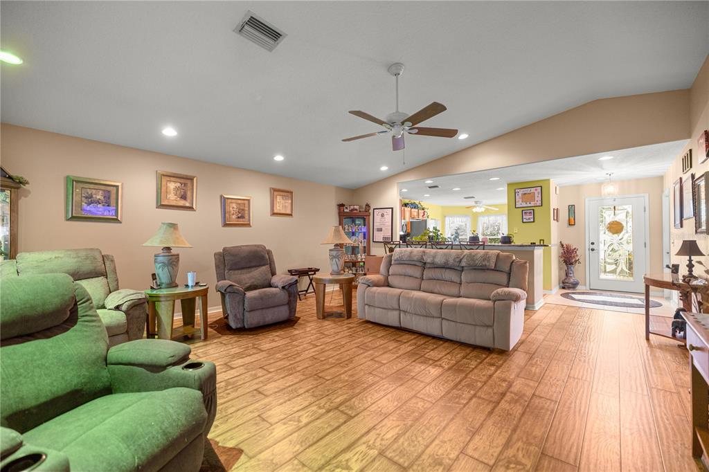 15771 Southwest 13th Circle Ocala, FL 34473 - Photo 12 of 29 a living room with furniture and a large window