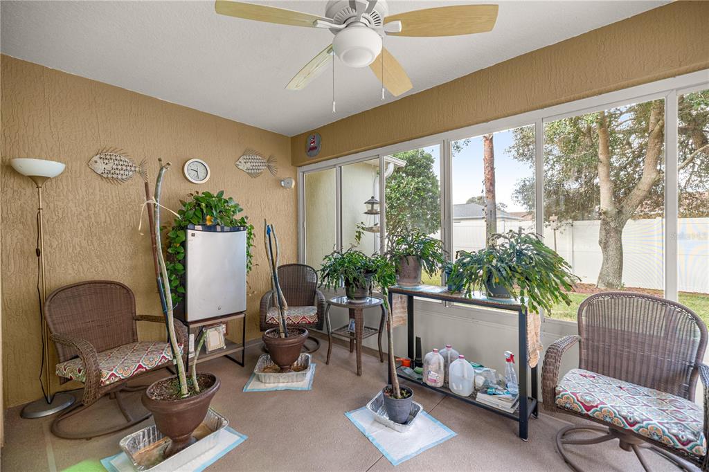 15771 Southwest 13th Circle Ocala, FL 34473 - Photo 13 of 29 a living room with furniture and a potted plant