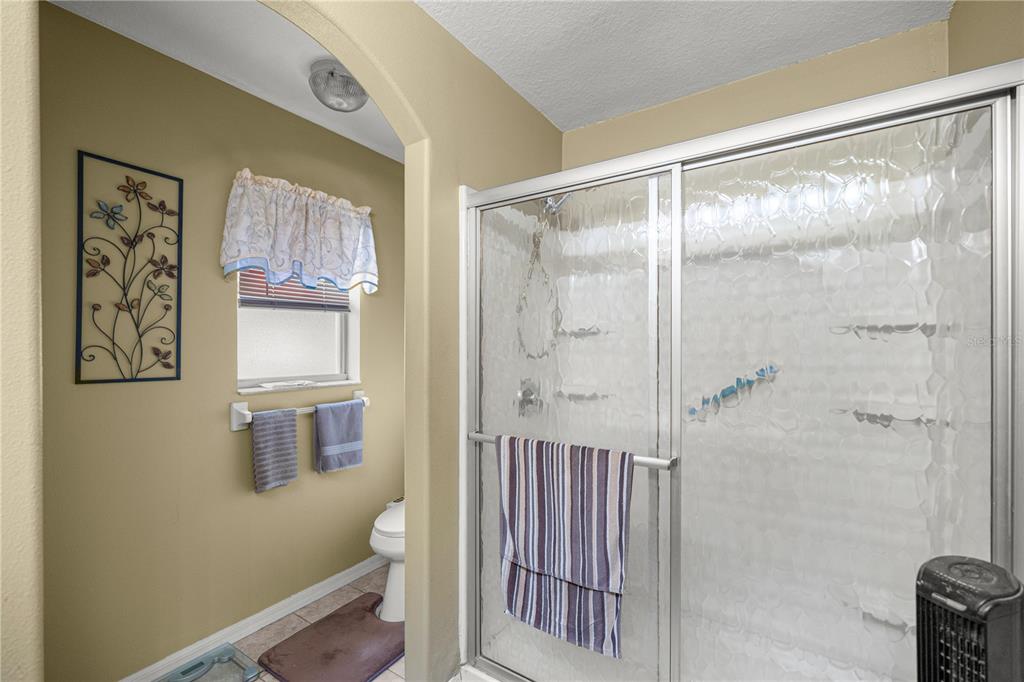 15771 Southwest 13th Circle Ocala, FL 34473 - Photo 18 of 29 a bathroom with a shower and a sink