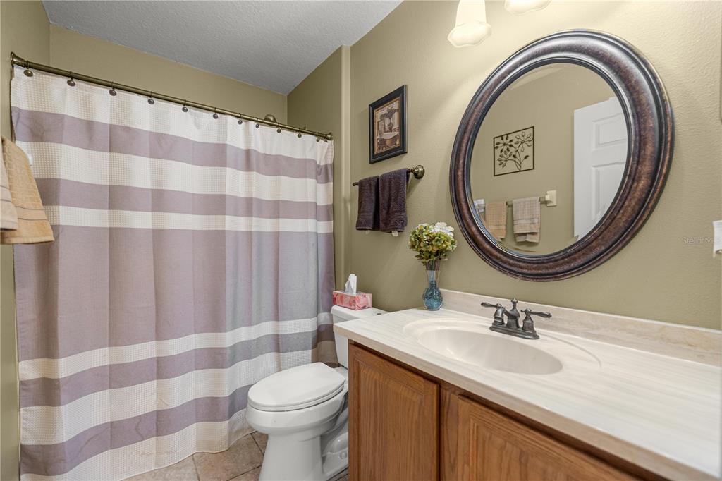 15771 Southwest 13th Circle Ocala, FL 34473 - Photo 19 of 29 a bathroom with a sink and a mirror