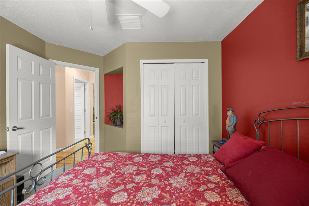15771 Southwest 13th Circle Ocala, FL 34473 - Photo 21 of 29 a bedroom with a bed and a closet