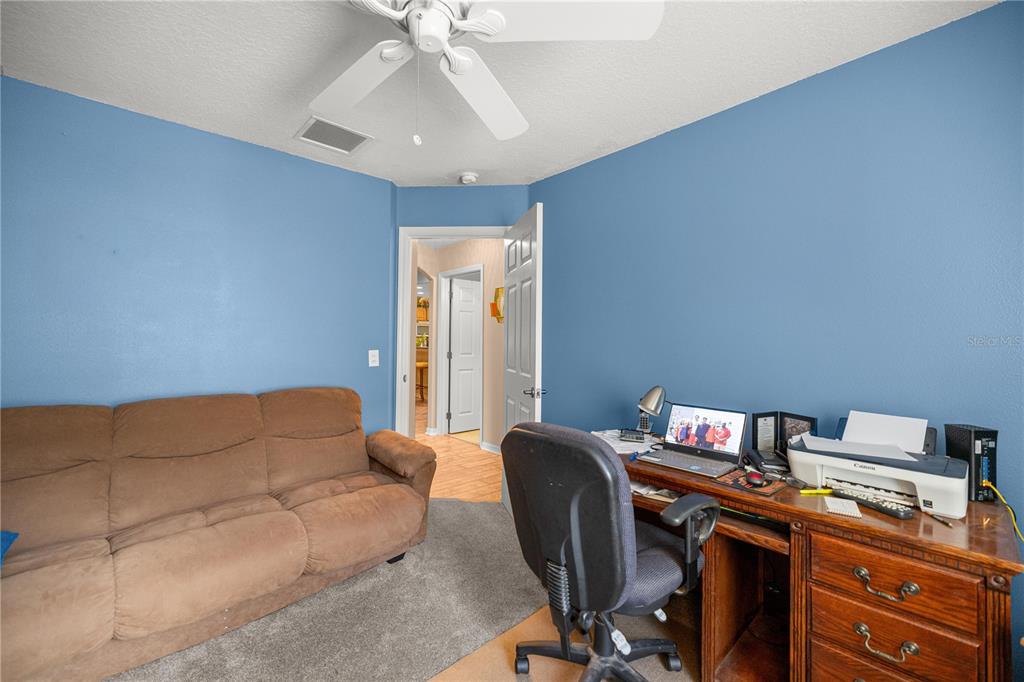 15771 Southwest 13th Circle Ocala, FL 34473 - Photo 22 of 29 a livingroom with workspace and a couch
