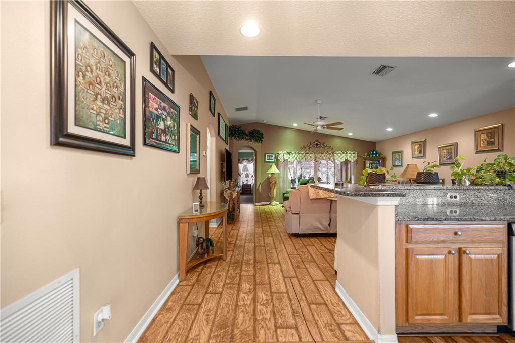 15771 Southwest 13th Circle Ocala, FL 34473 - Photo 5 of 29 a living room with stainless steel appliances furniture a rug and a kitchen view