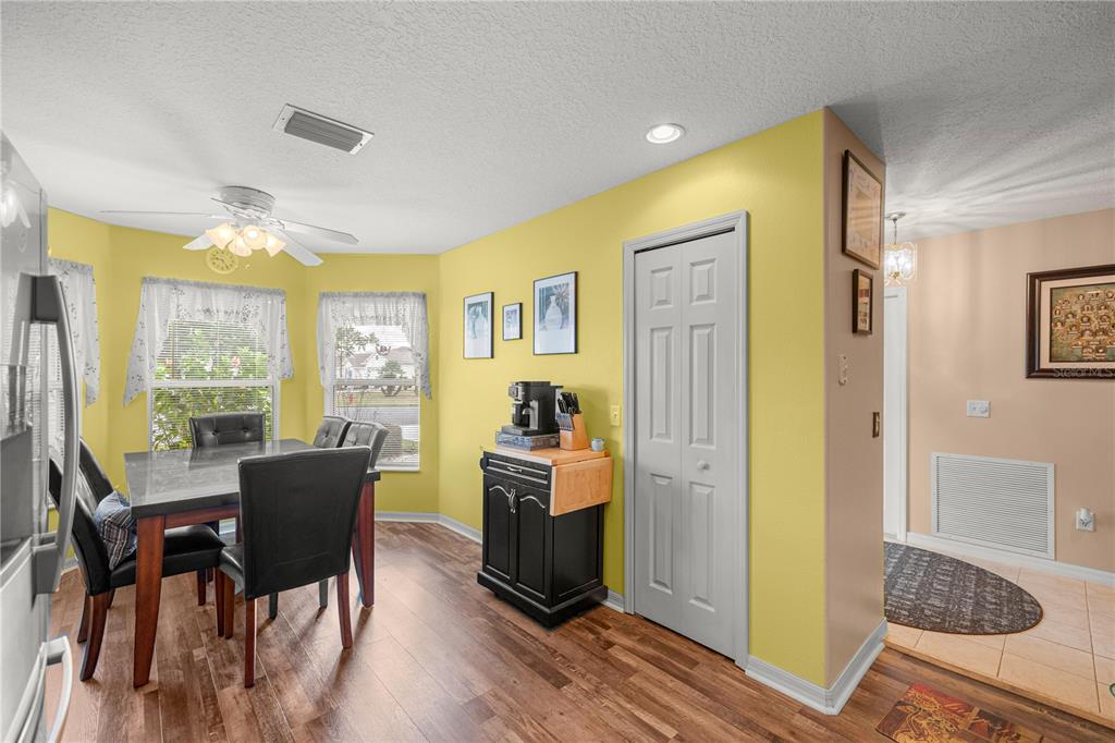 15771 Southwest 13th Circle Ocala, FL 34473 - Photo 8 of 29 a view of a dining room with furniture window and wooden floor