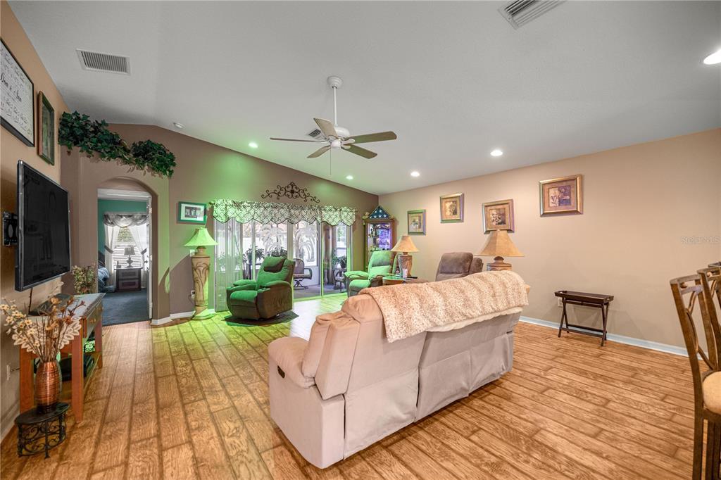 15771 Southwest 13th Circle Ocala, FL 34473 - Photo 10 of 29 a living room with furniture and a fireplace