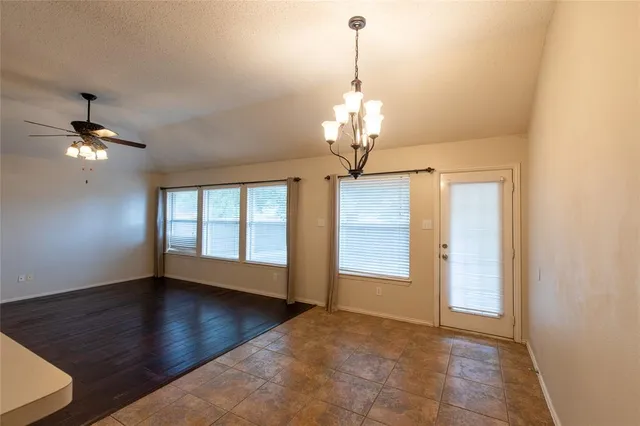 a view of a chandelier in big room and chandelier