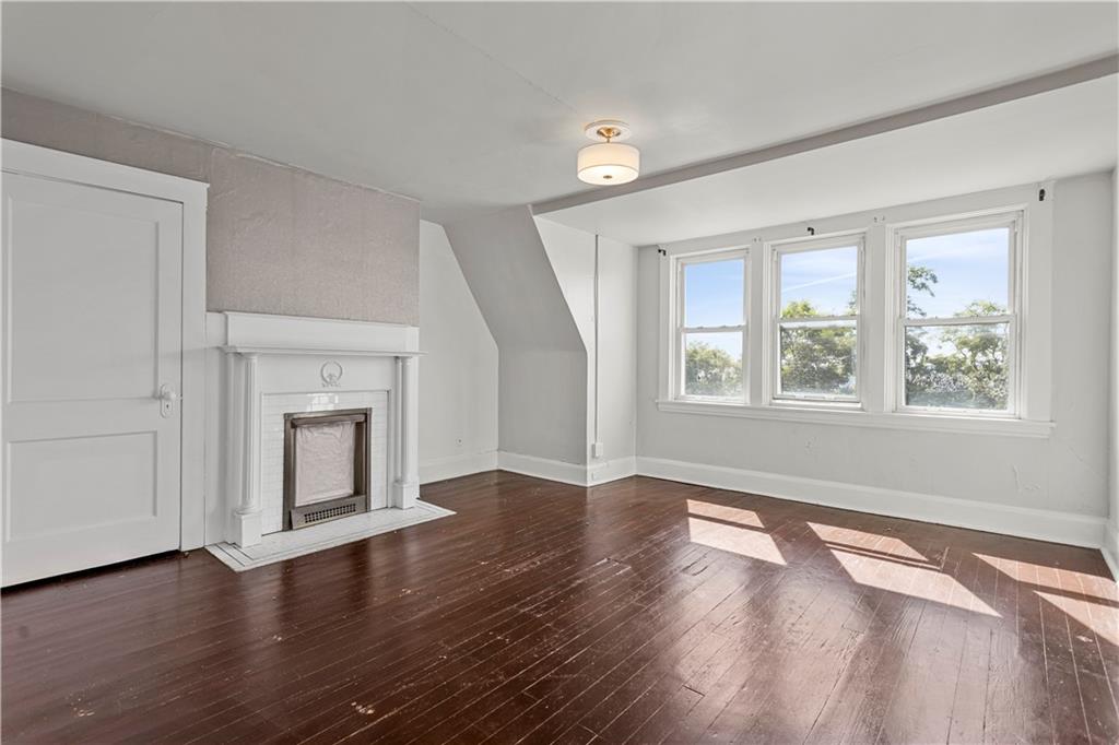 4048 Franklin Road Pittsburgh, PA 15214 - Photo 16 of 25 a view of an empty room with wooden floor and a window