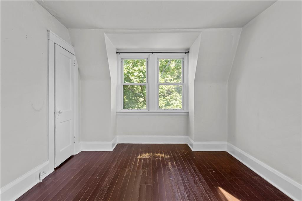 4048 Franklin Road Pittsburgh, PA 15214 - Photo 19 of 25 an empty room with wooden floor and windows