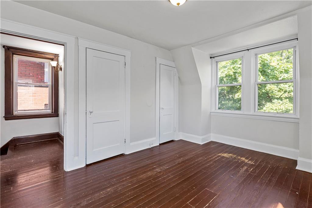 4048 Franklin Road Pittsburgh, PA 15214 - Photo 20 of 25 a view of empty room with wooden floor and fan