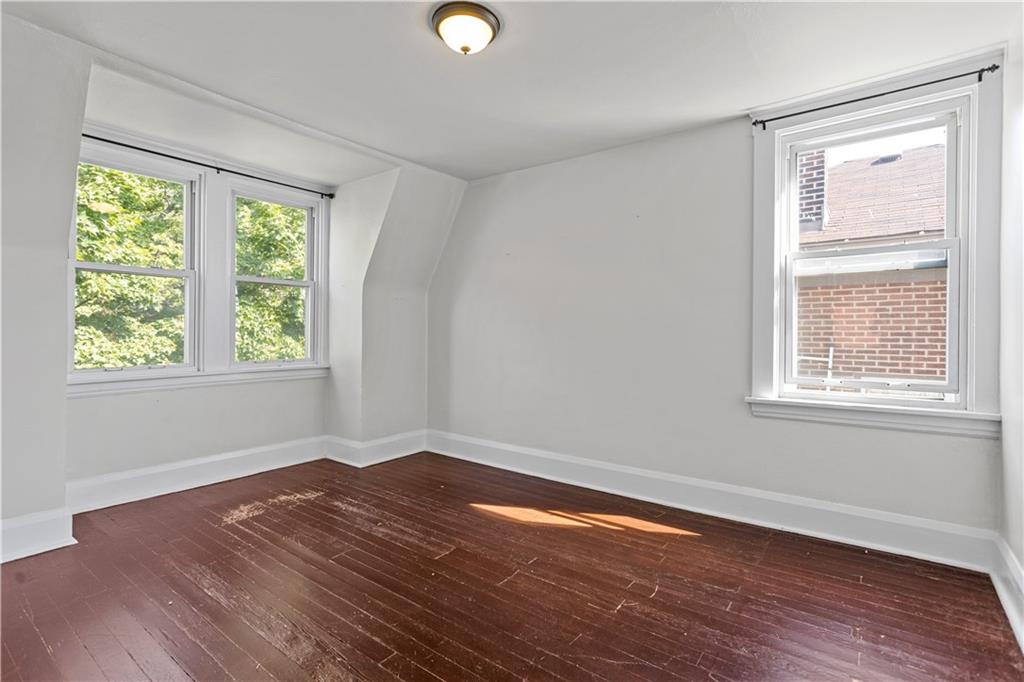 4048 Franklin Road Pittsburgh, PA 15214 - Photo 22 of 25 a view of a room with wooden floor and windows in it
