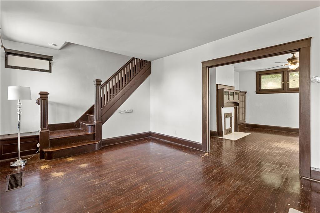 4048 Franklin Road Pittsburgh, PA 15214 - Photo 4 of 25 a view of an empty room with wooden floor and a window