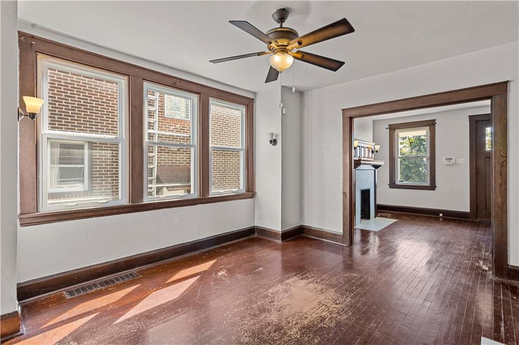 4048 Franklin Road Pittsburgh, PA 15214 - Photo 7 of 25 an empty room with wooden floor and windows