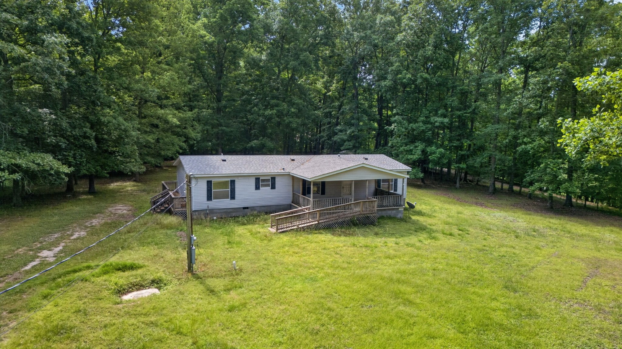 228 Shasteen Ridge Road Lynchburg, TN 37352 - Photo 50 of 53 a house view with a garden space