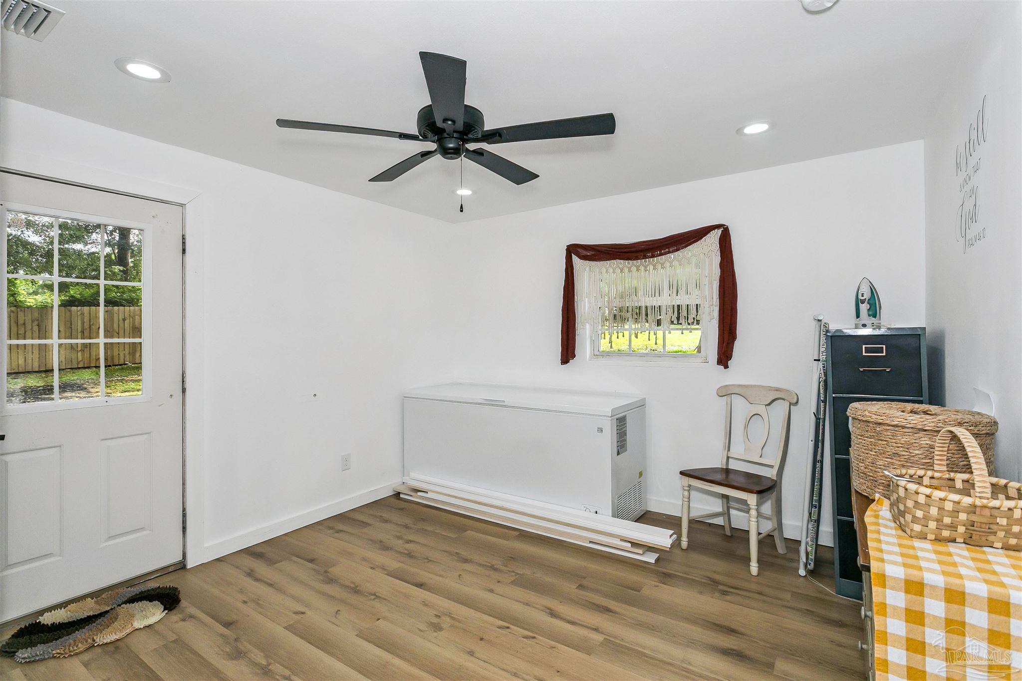 1095 River Annex Road Cantonment, FL 32533 - Photo 23 of 32 a view of workspace with wooden floor windows