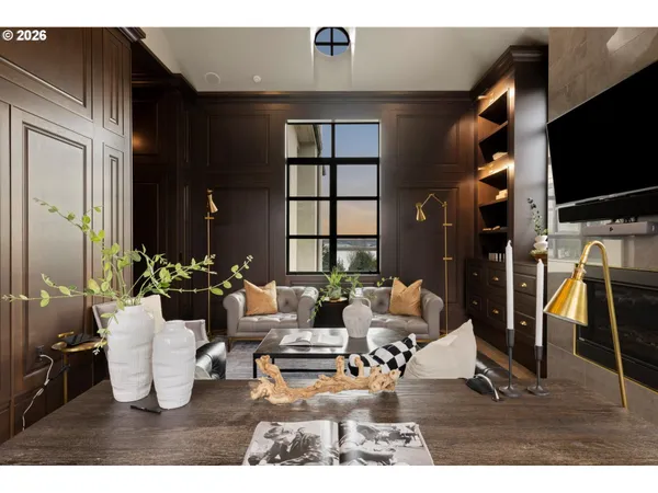 a living room with furniture a flat screen tv and a window