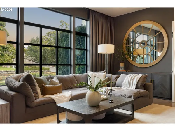 a living room with furniture and a large window