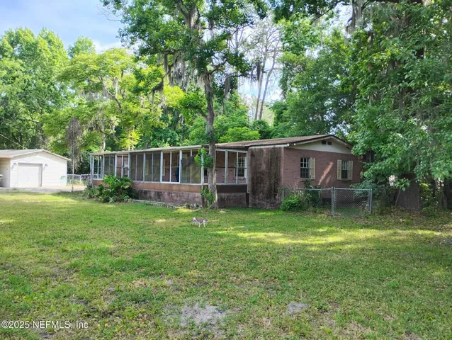 a backyard of a house with seating space