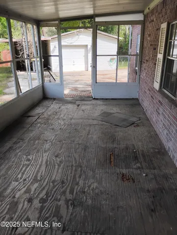 a view of empty room with front door