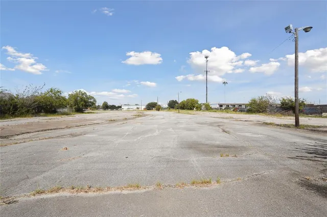 a view of a road with a big yard
