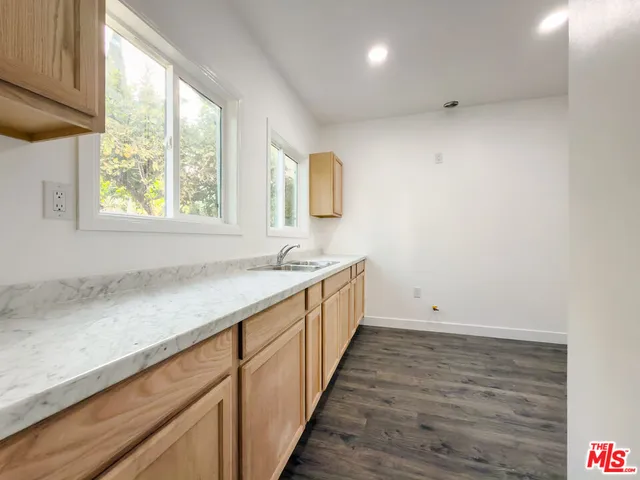 a bathroom with a sink and a window
