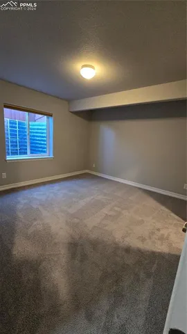 an empty room with closet area