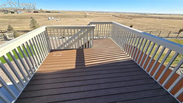a kitchen with granite countertop stainless steel appliances and wooden cabinets